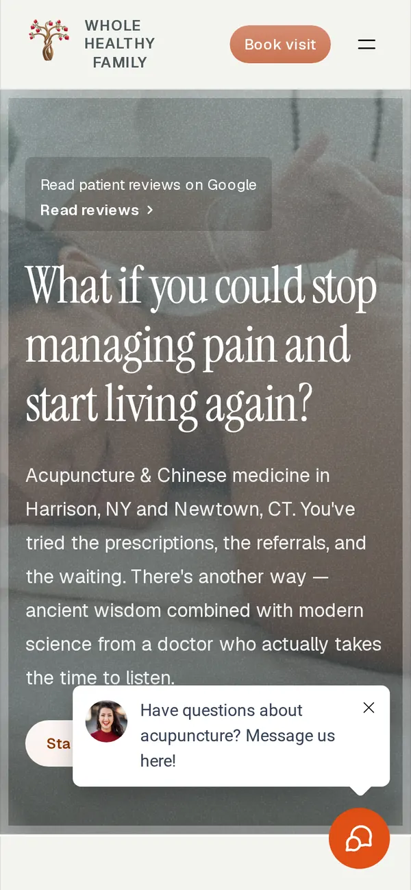 The same Whole Healthy Family homepage on a phone, with the practice’s chat open